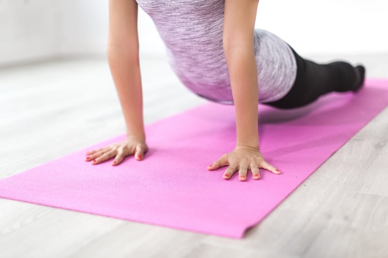 young woman doing yoga exercise