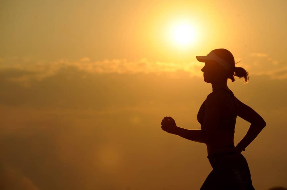 silhouette jogger going for a morning run
