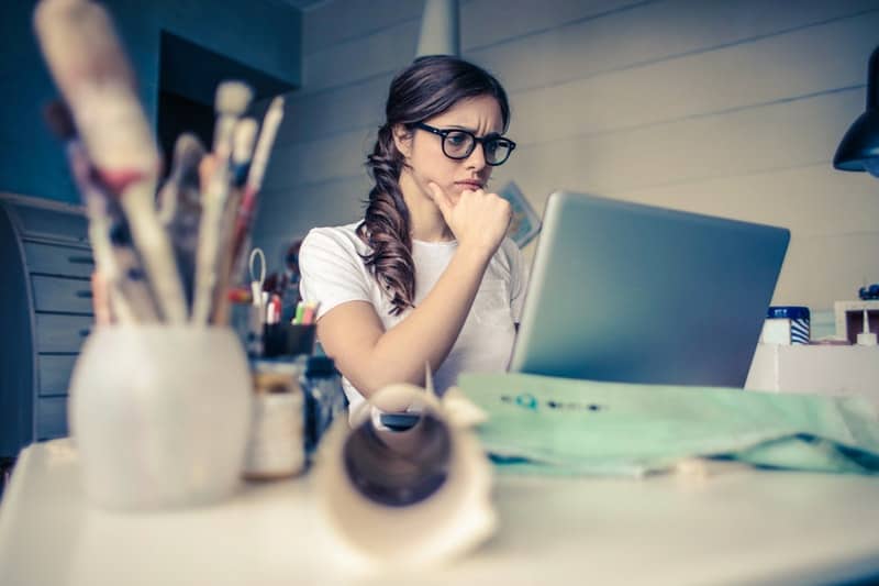 young woman researching her college essay