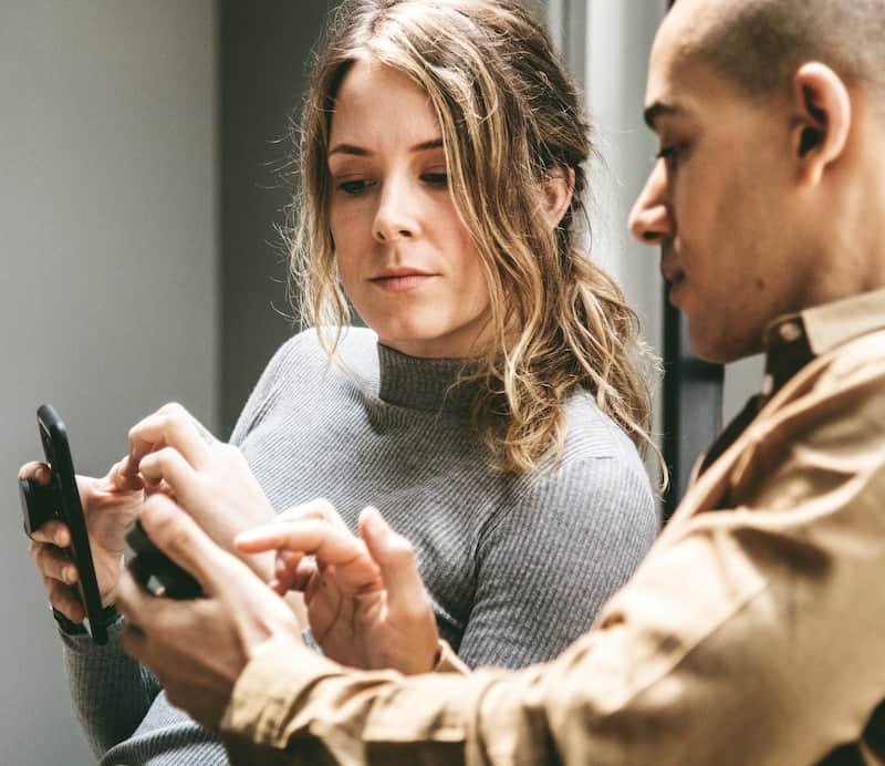 Man Teaching Woman Social Media