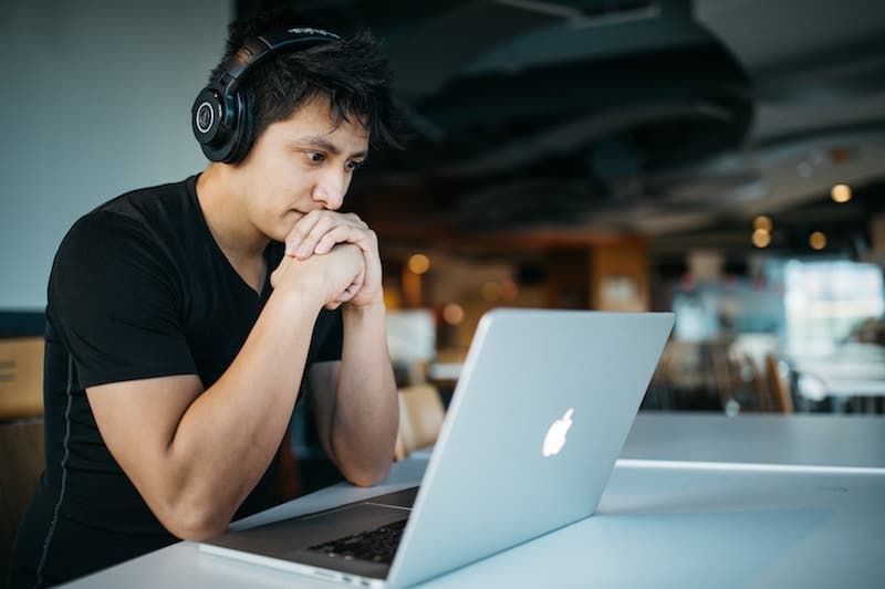 Man Watching an online courseon his laptop