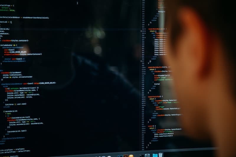 Man sitting at his workspace coding a new software
