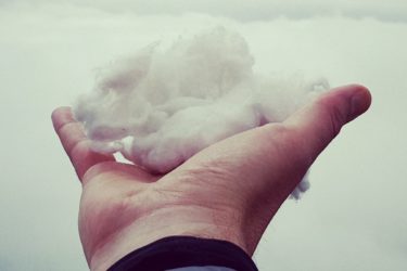 Man Holding a small cloud in his hand