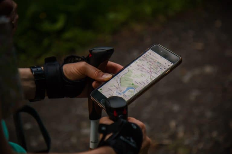 How to Install and Troubleshoot - Man Using Garmin Maps On His Smartphone 768x512