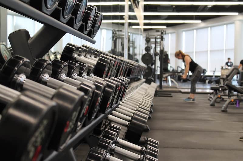 Woman Working out inside a modern clean gym