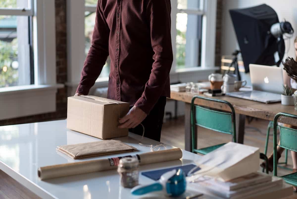 Man packaging a box to ship