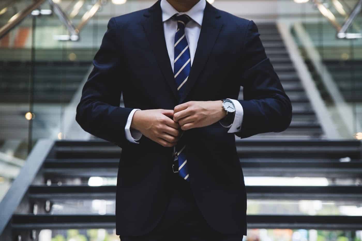 Business Man Fixing his Suit