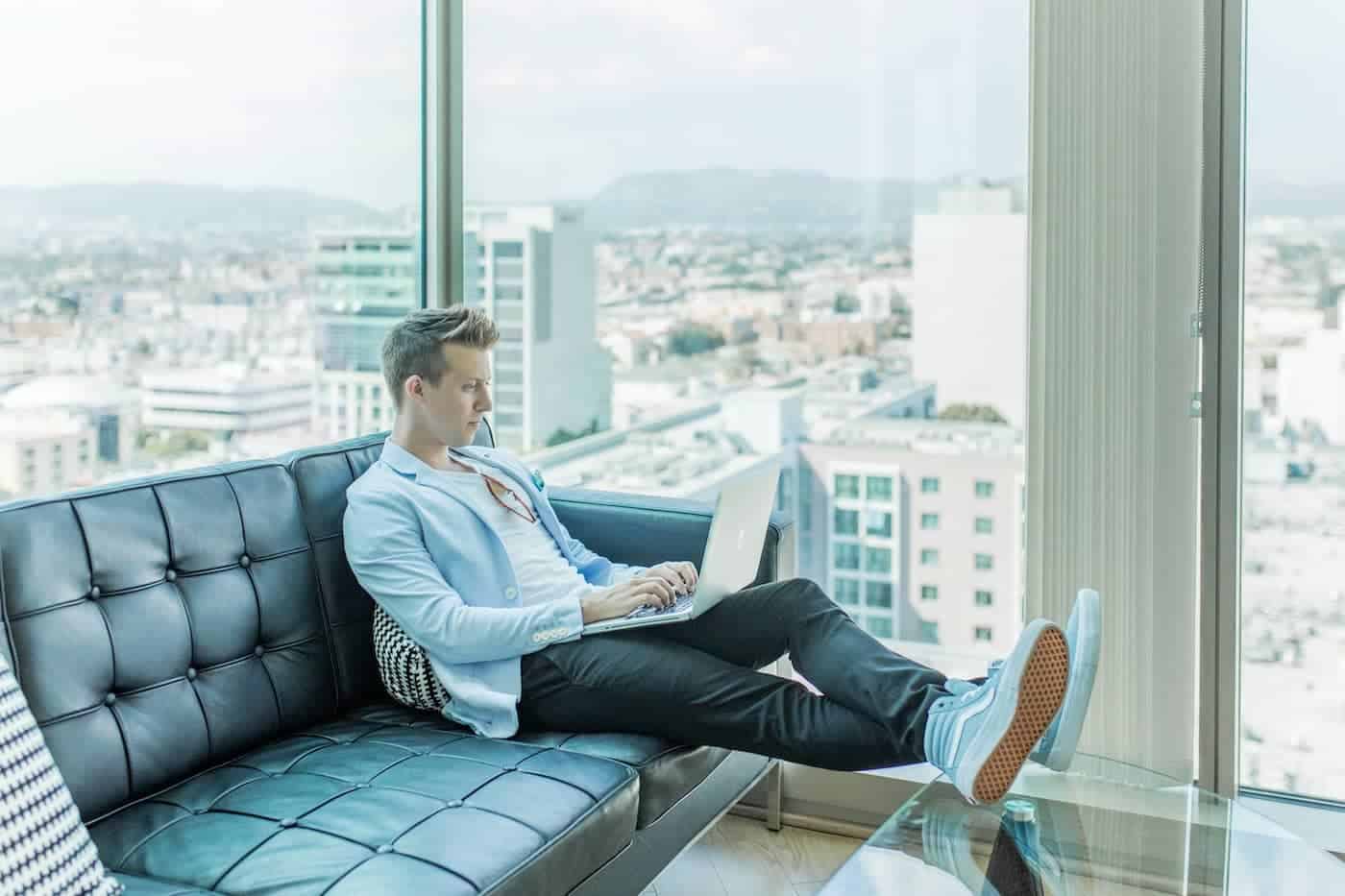entrepreneur working in an office building overlooking the city