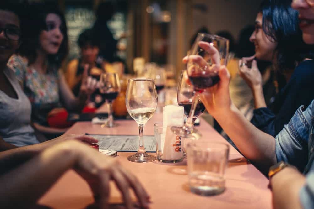people drinking wine at a restaurant