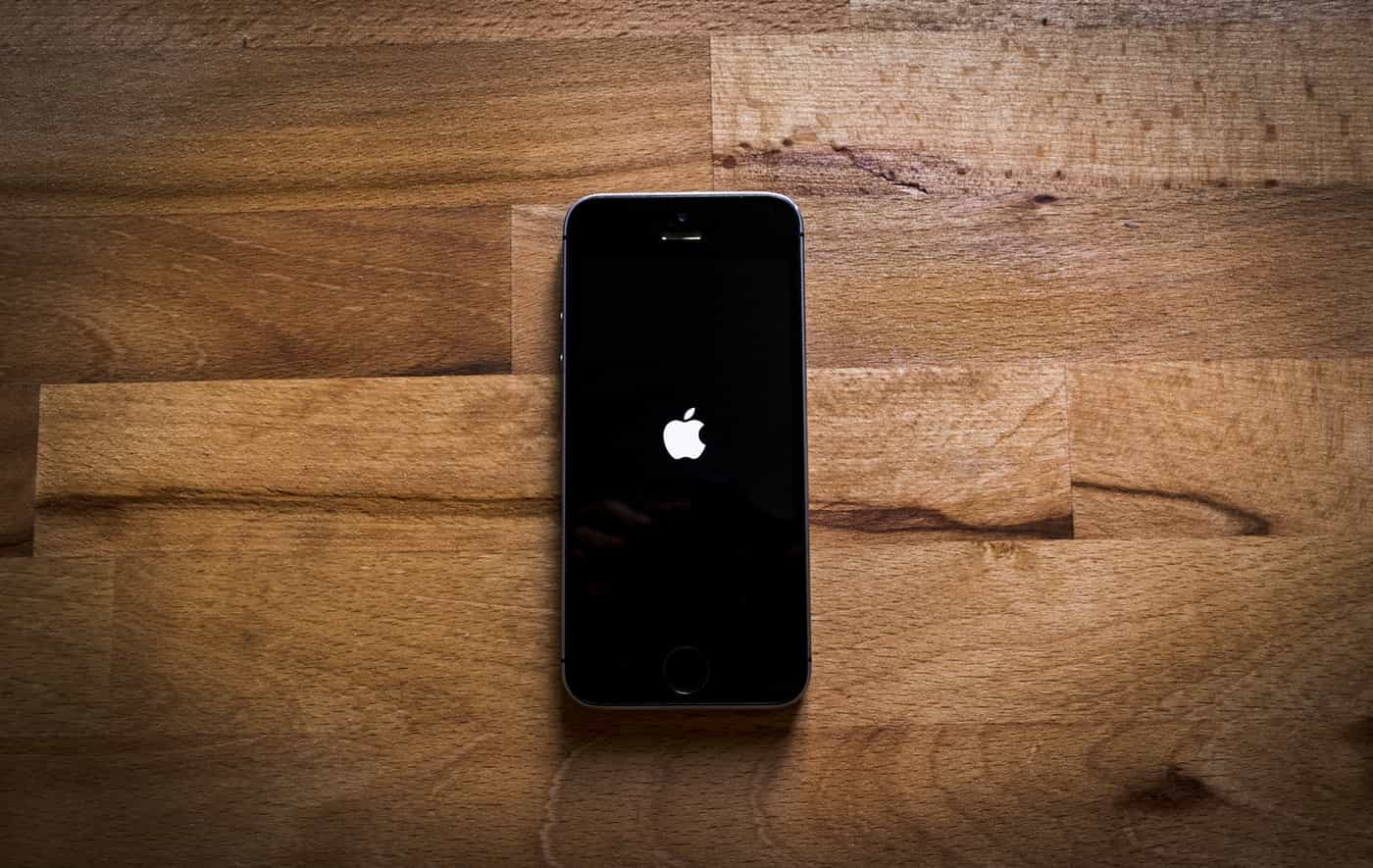 Iphone 5 with the apple logo on screen