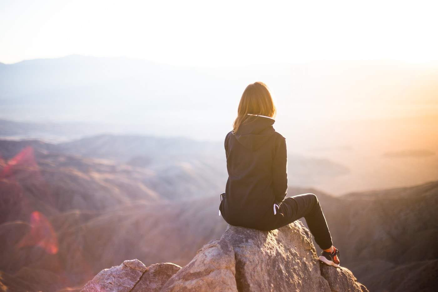 Woman looking out onto the mountains