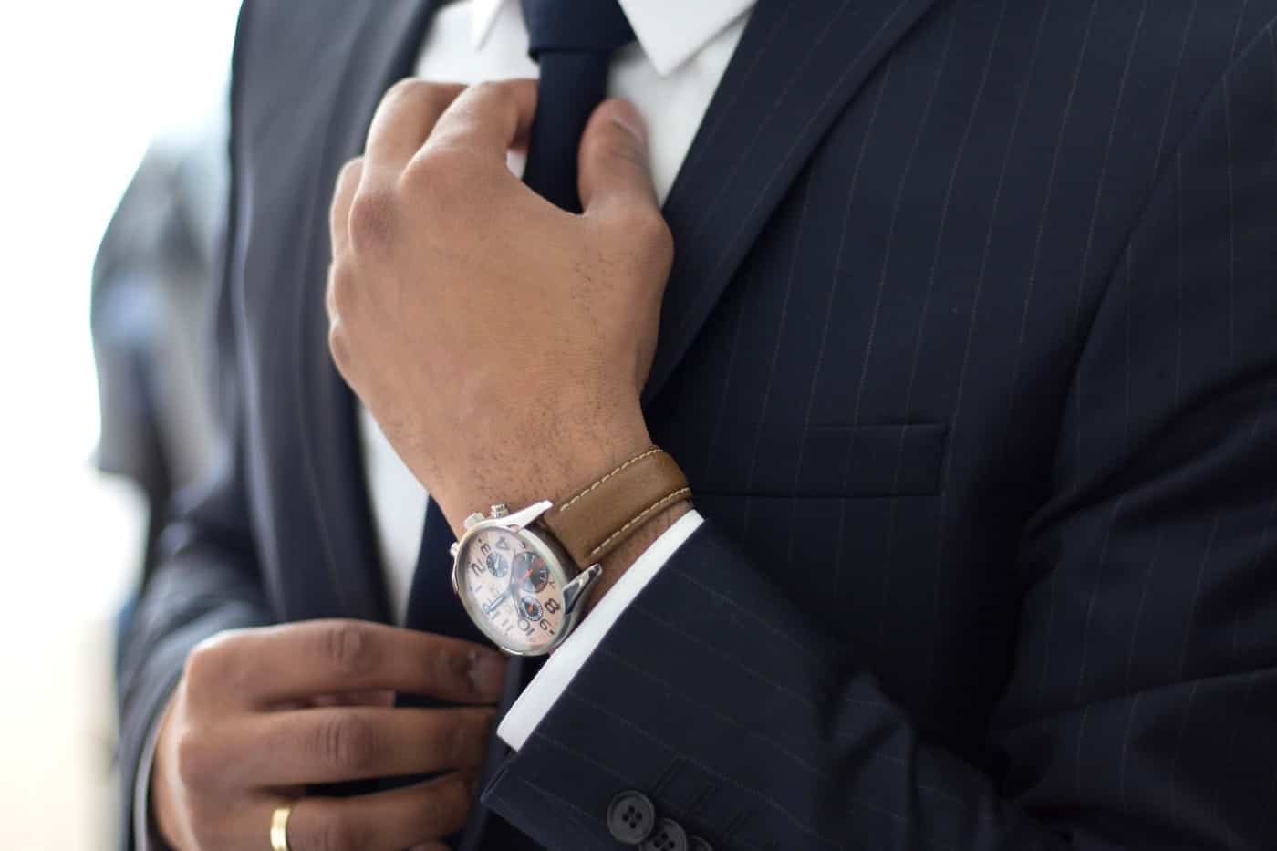 Businessman Fixing His Tie