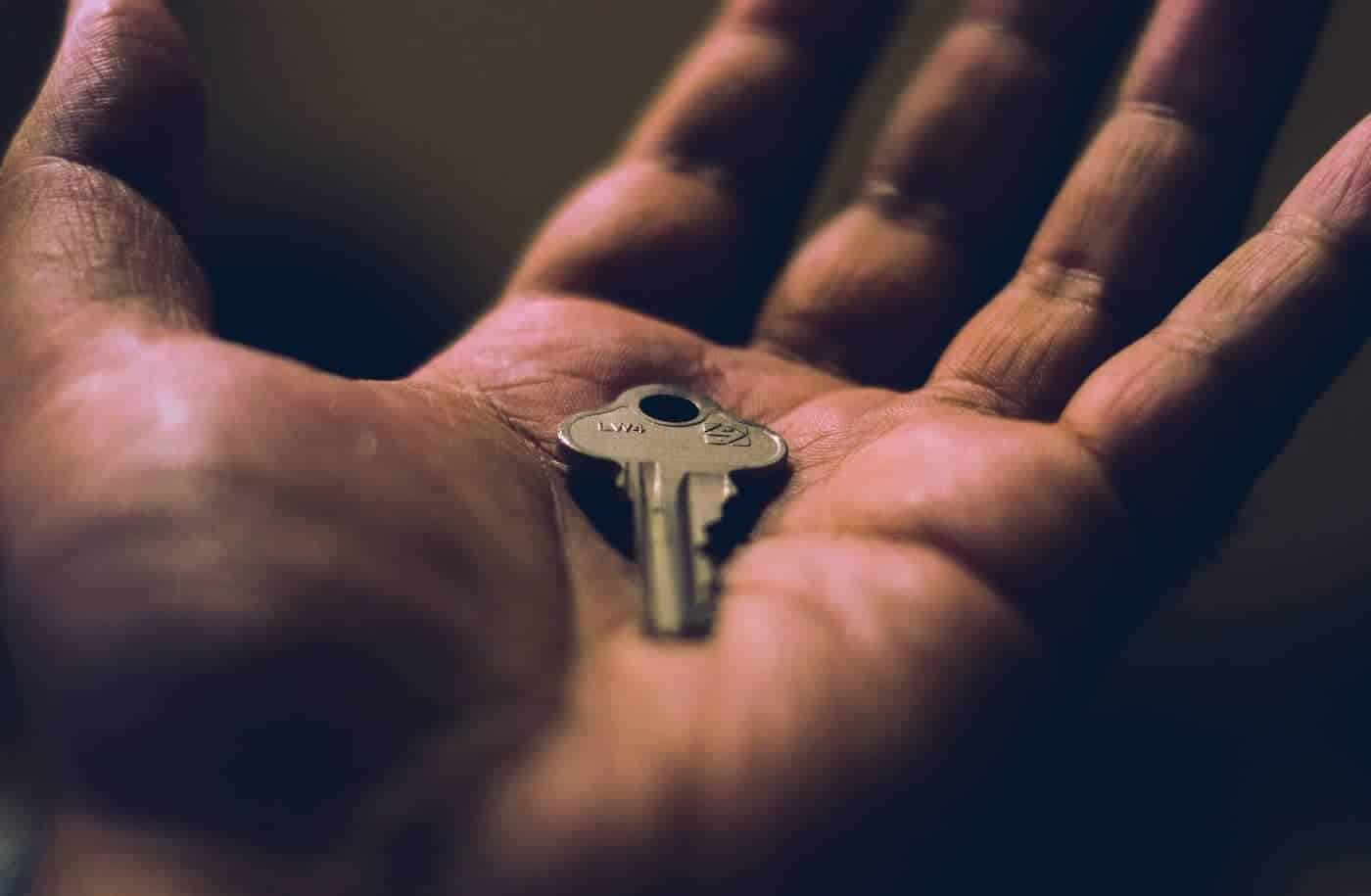 Man Holding a Key in His Hand