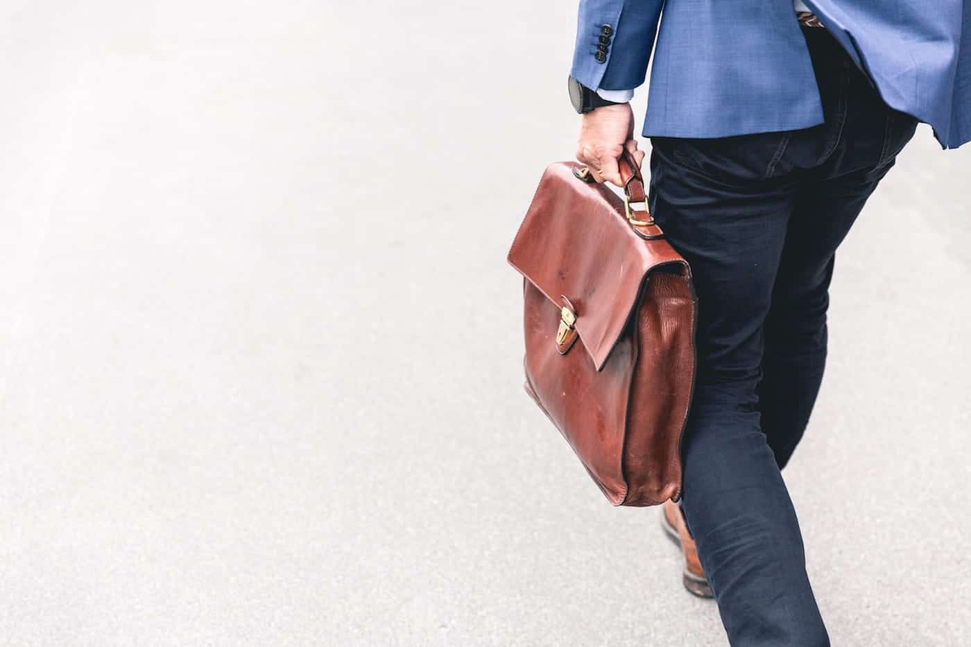 Man Carrying a Leather Briefcase