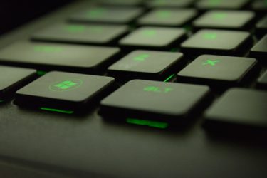 Windows Button on a Backlit Green Keyboard