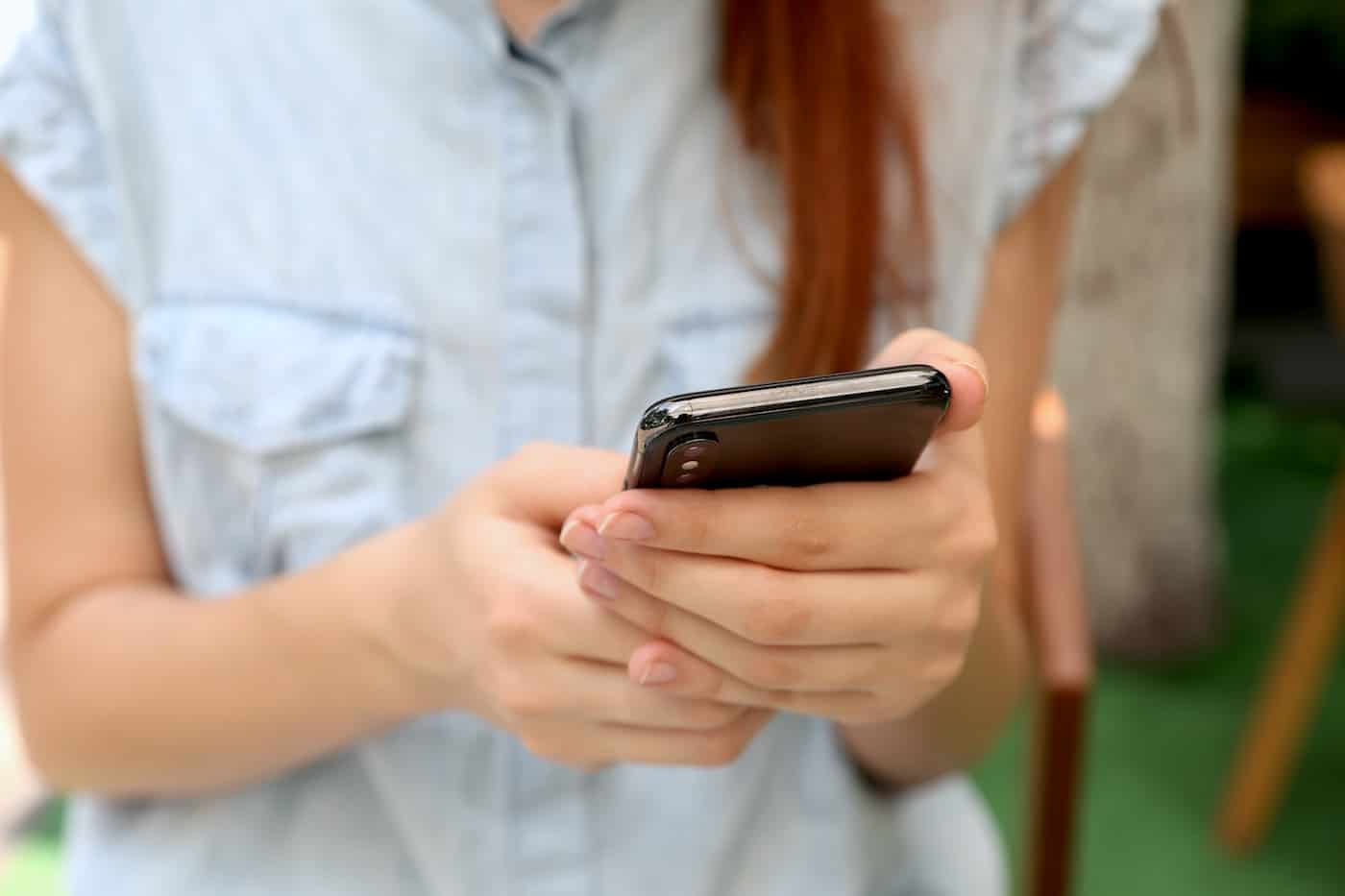 Young Girl Using her Smartphone