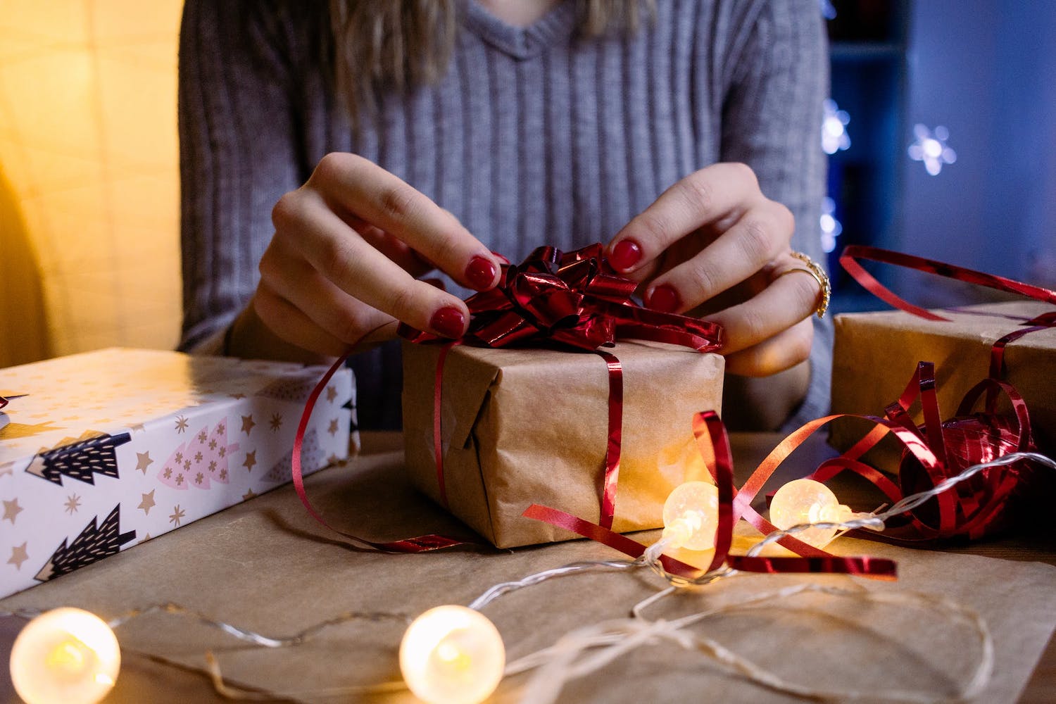 a woman wrapping a gift