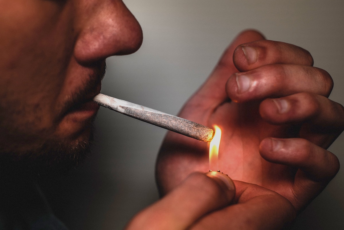 Man Lighting a Joint