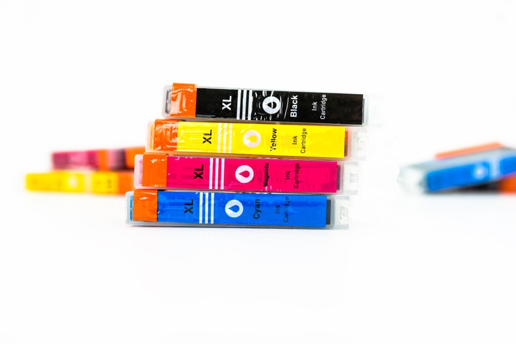 close-up-shot-of-a-cmyk-ink-cartridges-for-a-color-printer-isolated-on-a-white-background-printer