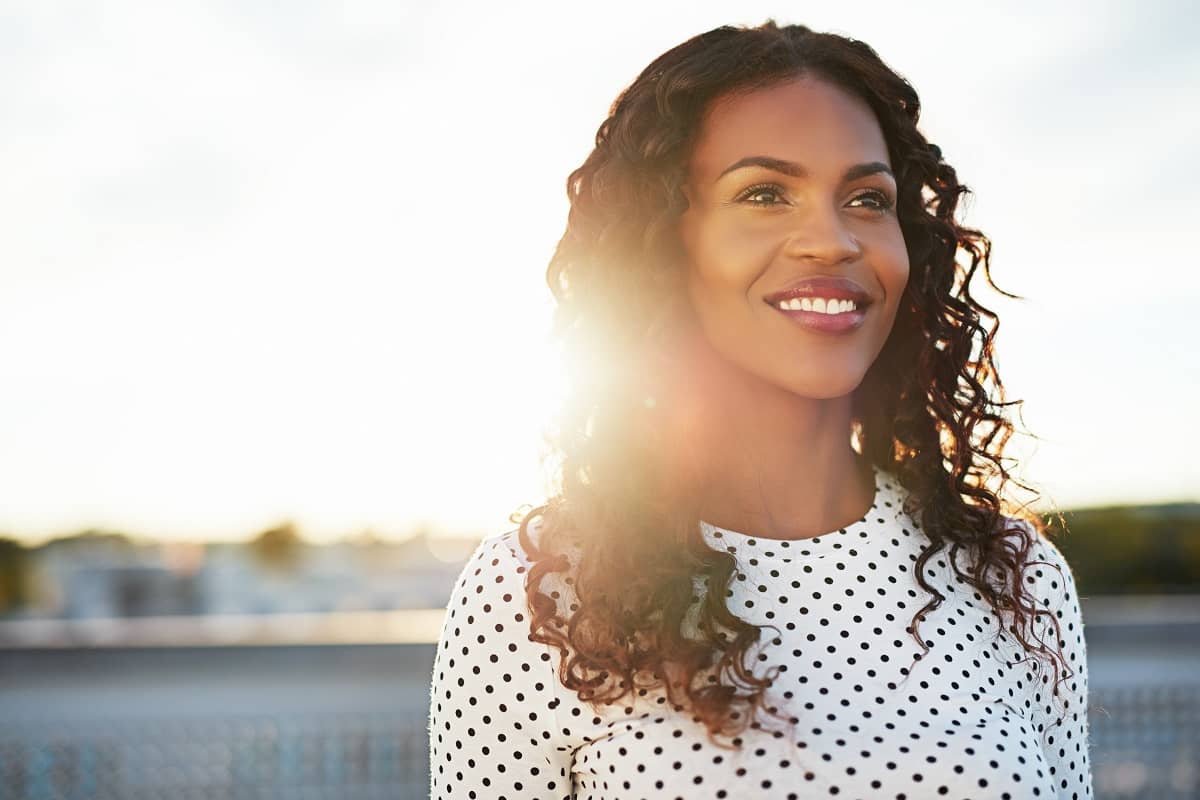 Happy Confident Woman Standing During sunset