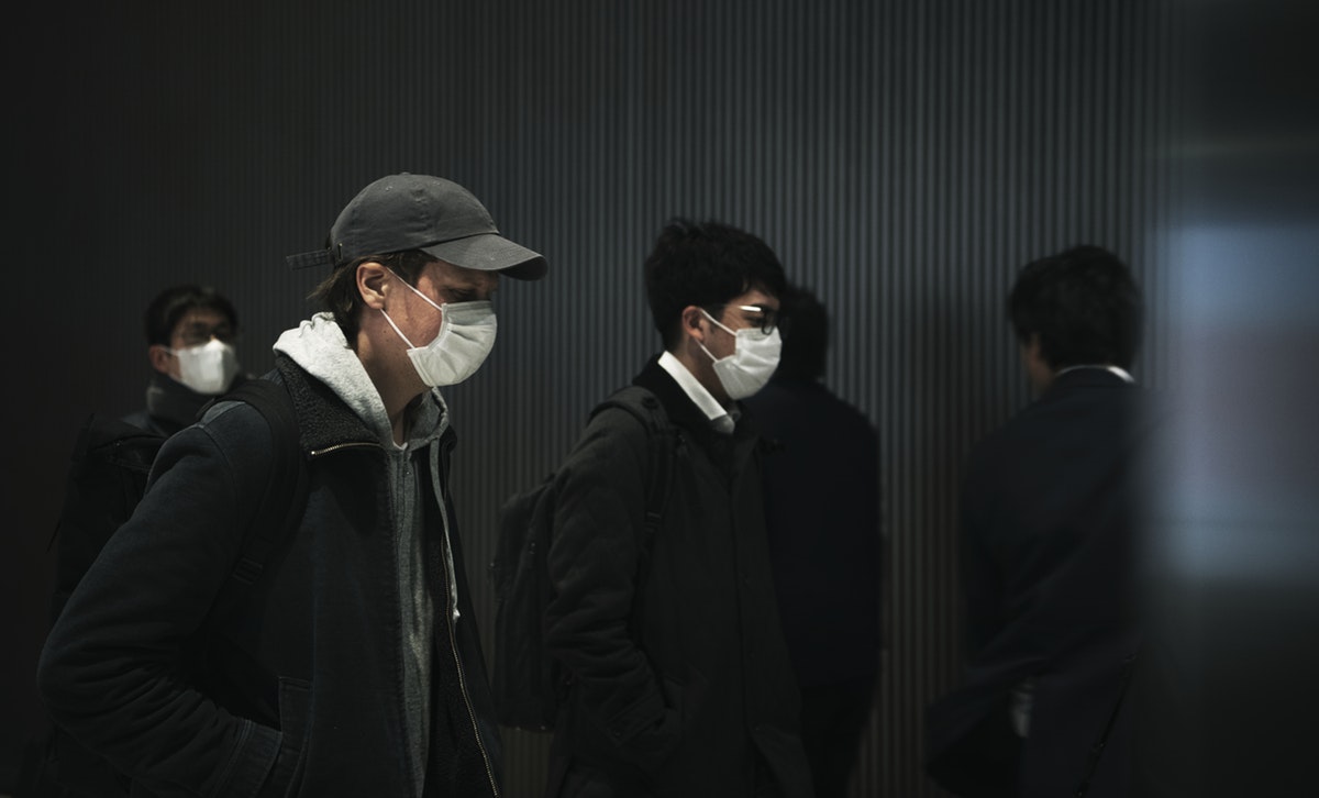 Commuters wearing disposable masks hoping to prevent the spread of corona virus
