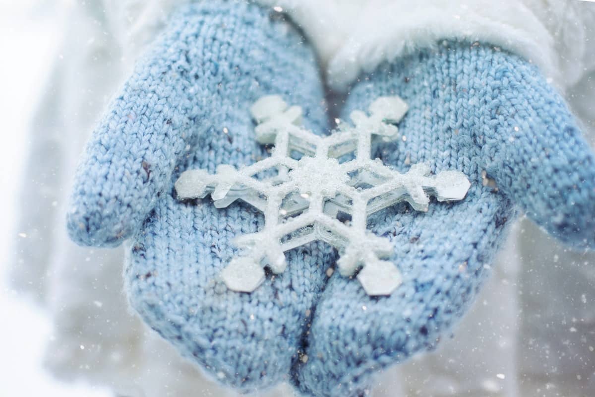 Girl Holding a Massive Snowflake