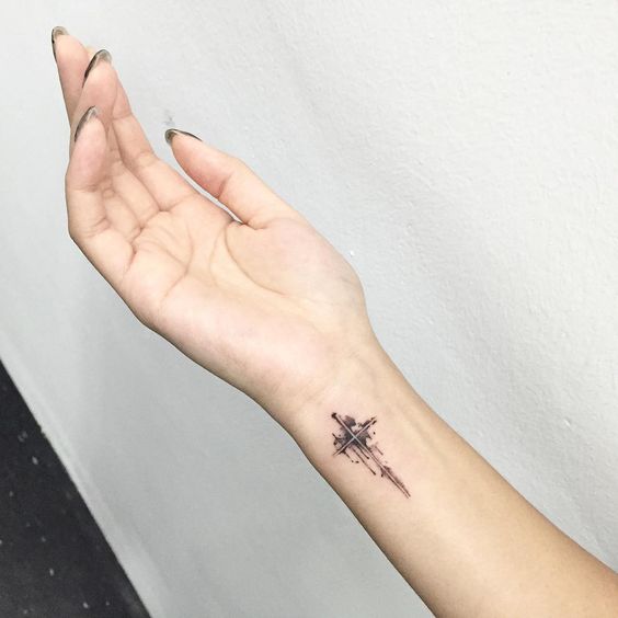 side wrist cross tattoo