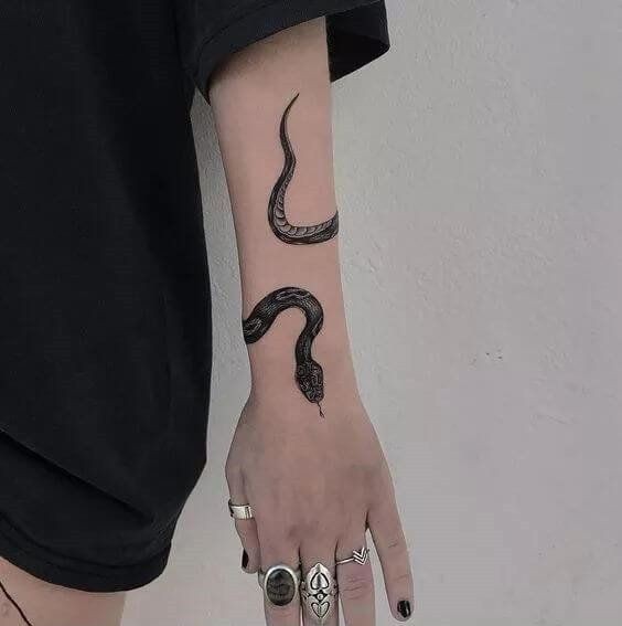 It does not matter if you are male or female snake tattoo will look special  on your forearm