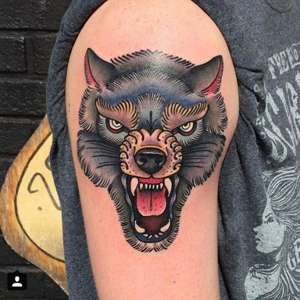 silver and red wolf tattoo