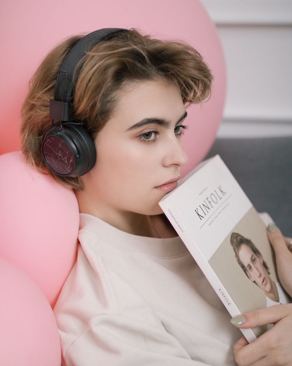 Attractive Woman Listening to Podcast at Home