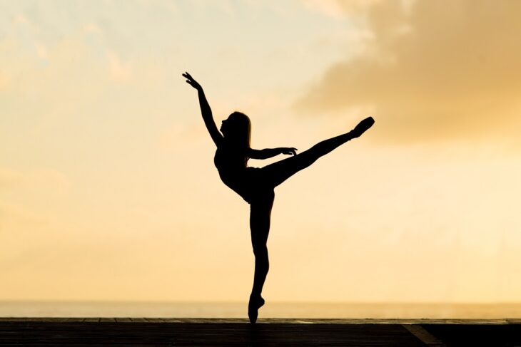 Woman Dancing During Sunset