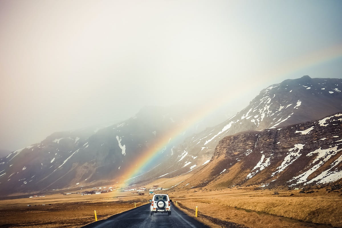 Car Driving Through a Rainbow