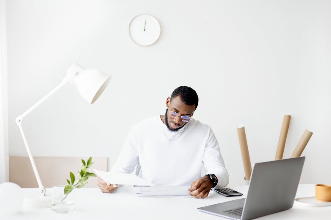 Man Working From Home While Wearing Glasses